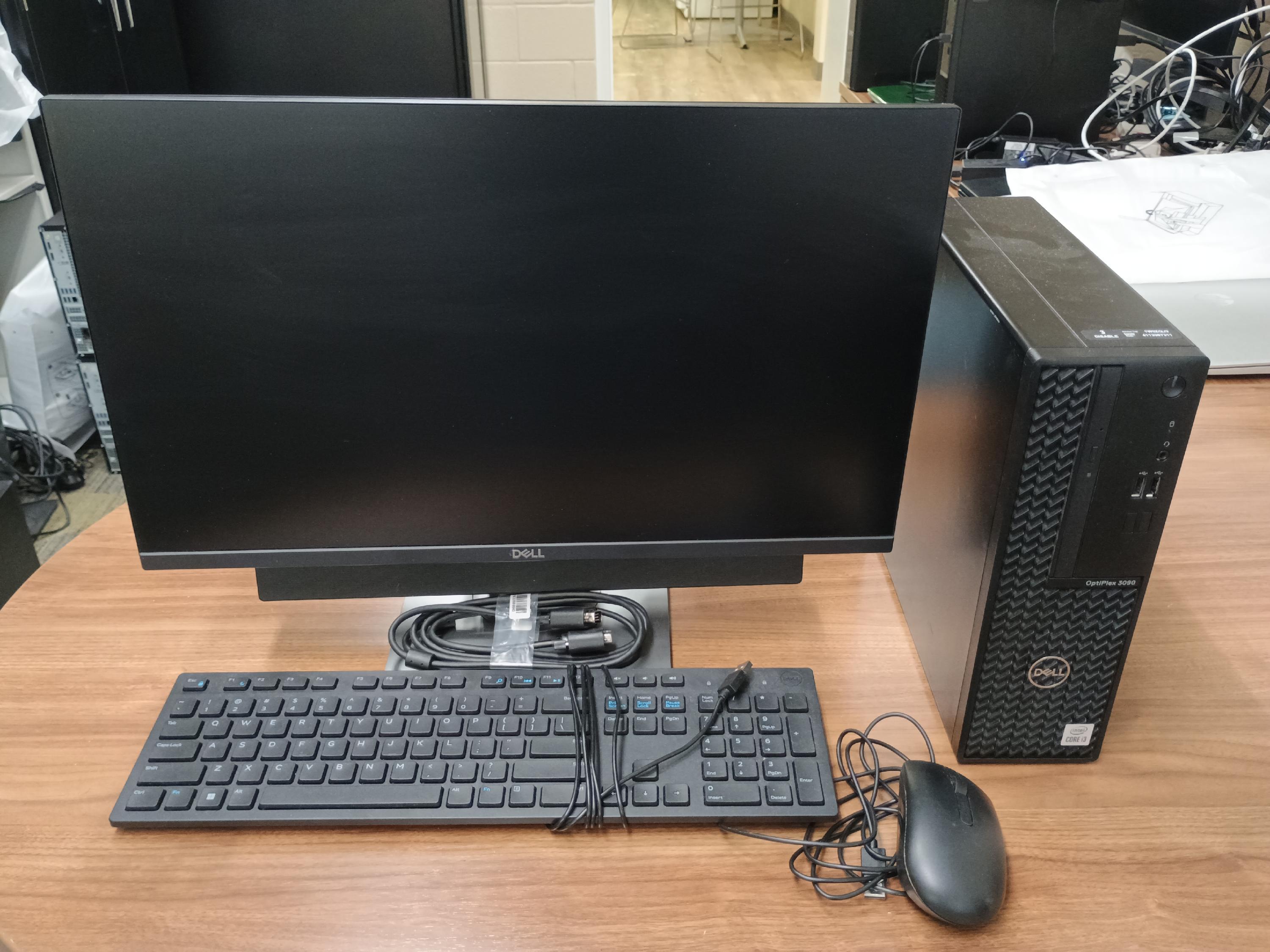 Desktop computer with monitor, keyboard, mouse and cables.
